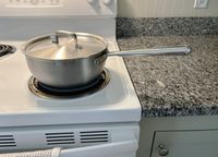 The Misen 2-Quart Saucier on a white stovetop