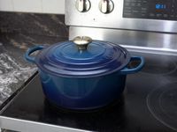 le creuset dutch oven on a stovetop