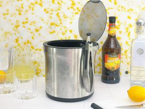 oxo ice bucket on a white tile surface