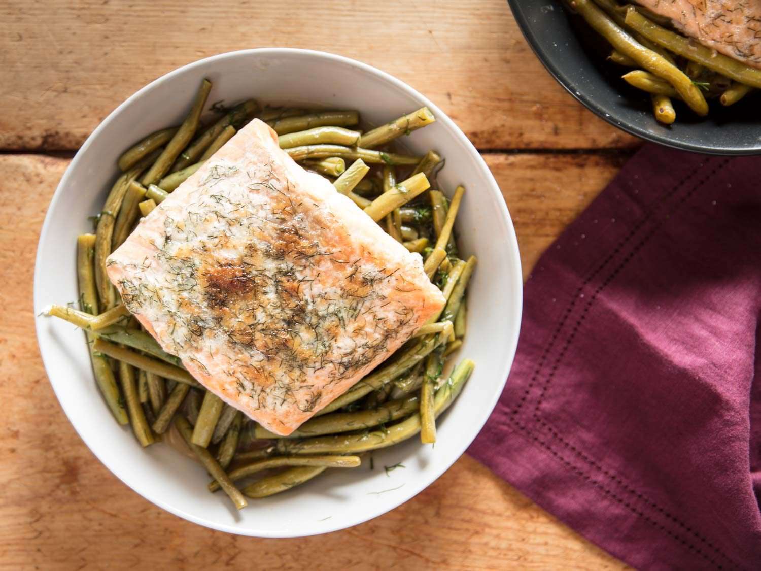 overhead closeup of broiled dilly salmon with green beans