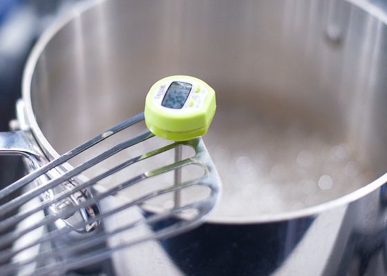 checking temperature of mixture