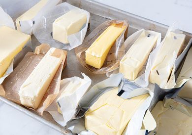 Eleven sticks of unwrapped unsalted butter.