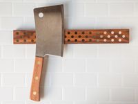 A cleaver on a magnetic knife strip