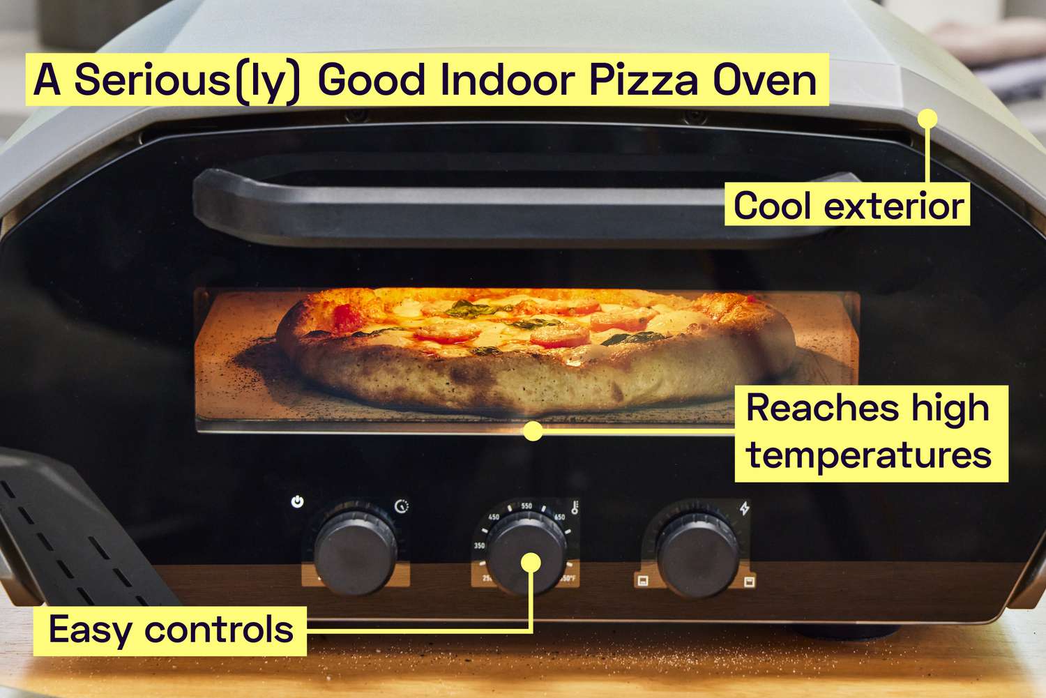 An indoor pizza oven cooking a pizza