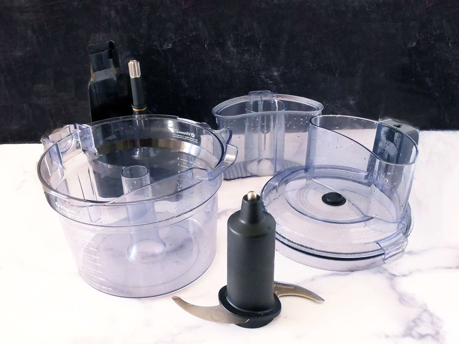 The vitamix food processor parts on a marble countertop