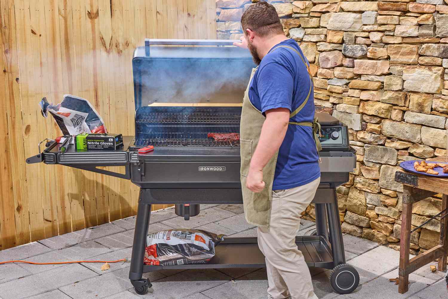 A person grills using the Traeger Ironwood XL