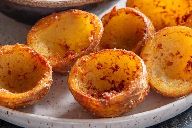 Deep-fried potato-skin cups ready for dipping or filling. 