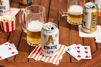 can of athletic lite with a beer glass behind it