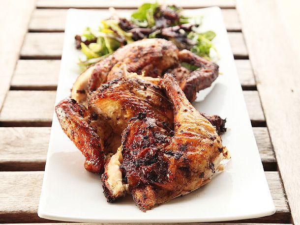 Grilled jerk chicken on a platter