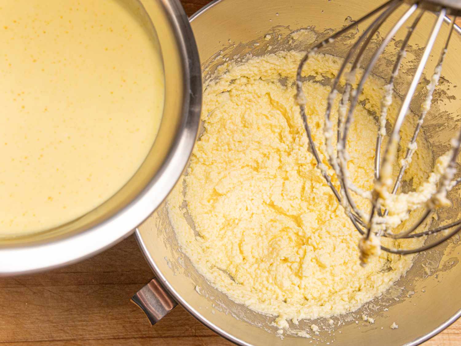 yogurt mixture in bowl, pouring into mixture in stand mixture with whisk