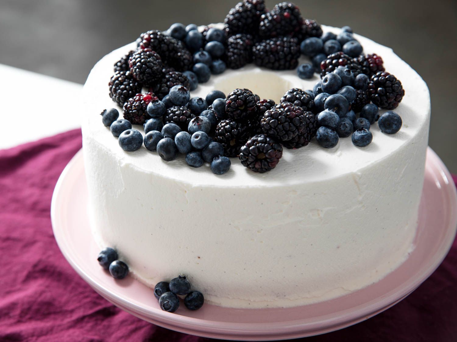 Chiffon cake frosted in cream and topped with fresh berries