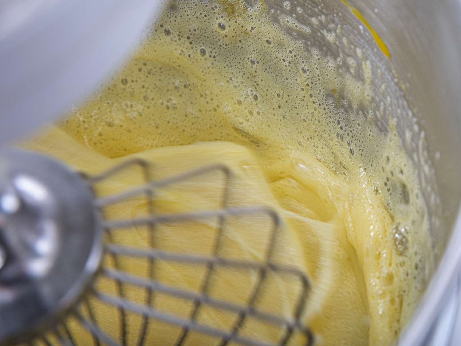 Eggs being whisked in a stand mixer
