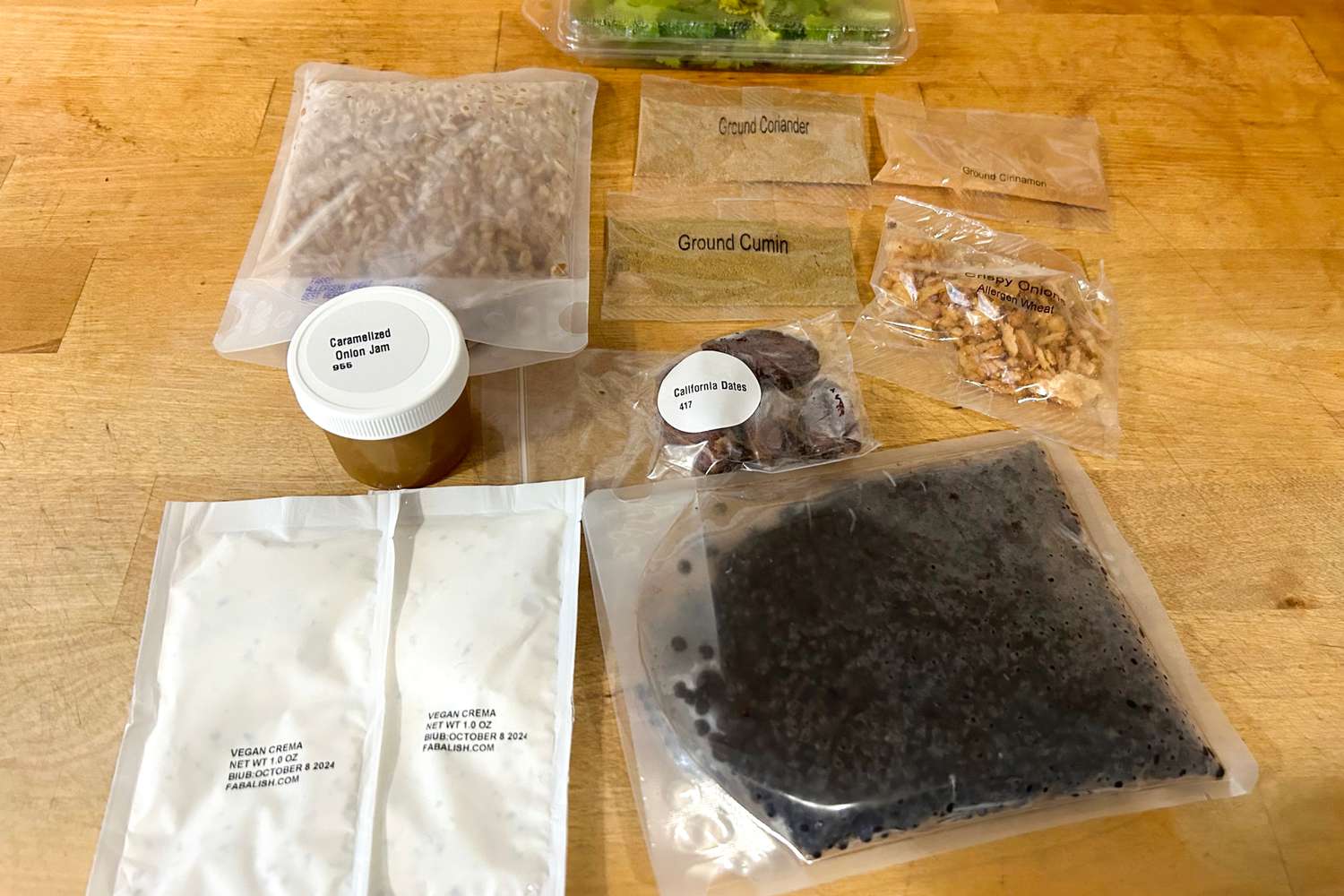 Purple Carrot meal ingredients on a wood surface