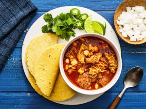 Overhead view of menudo rojo in a bowl in a plate