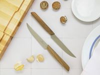the victorinox modern knives on a white tile surface