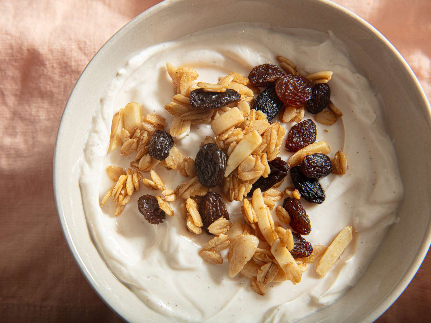 Overhead view of granola on yogurt