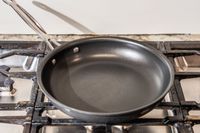 The Cuisinart 622-24 Chef’s Classic Nonstick Skillet on a stovetop.