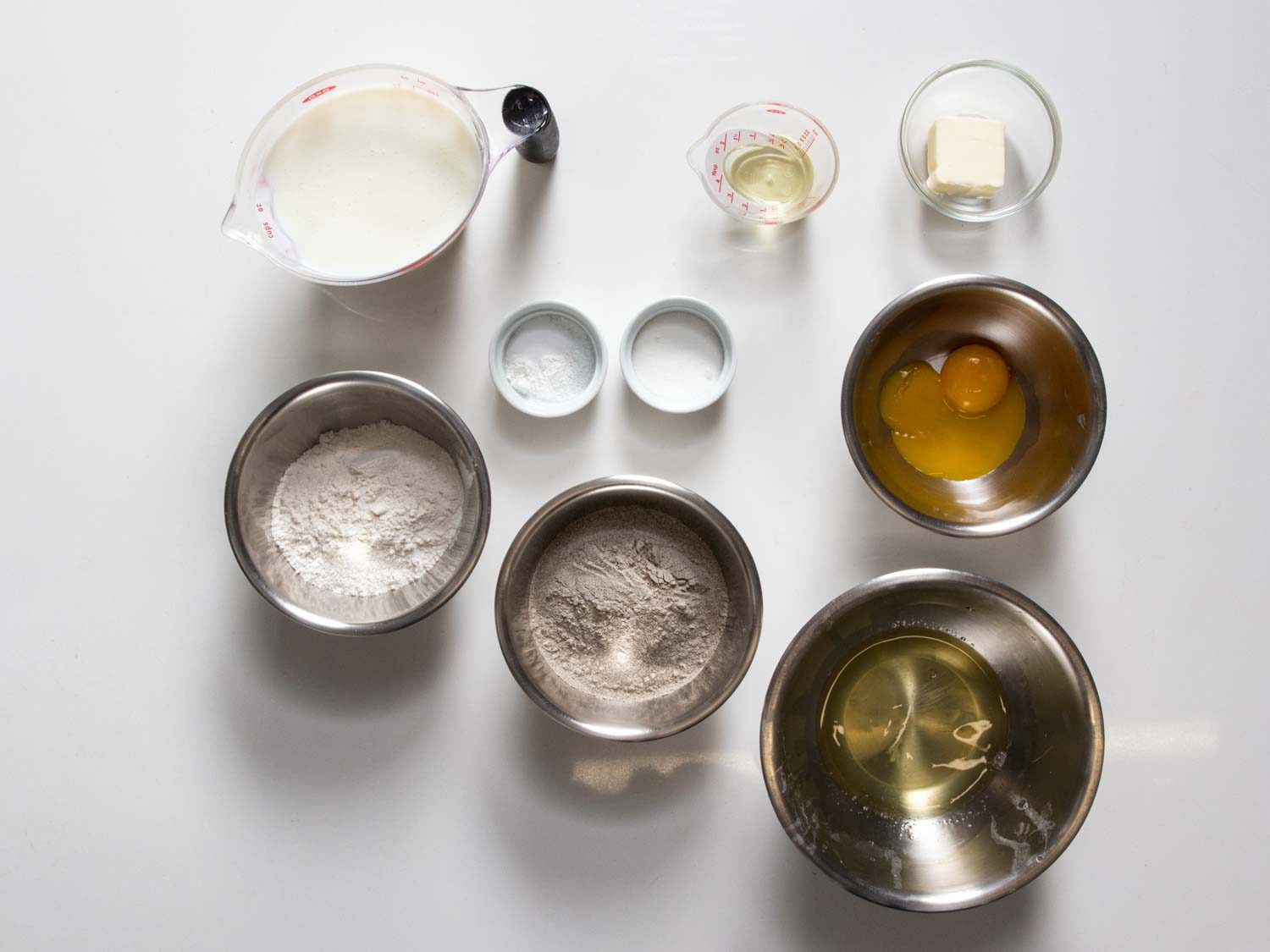 Buckwheat blini ingredients on a white surface.