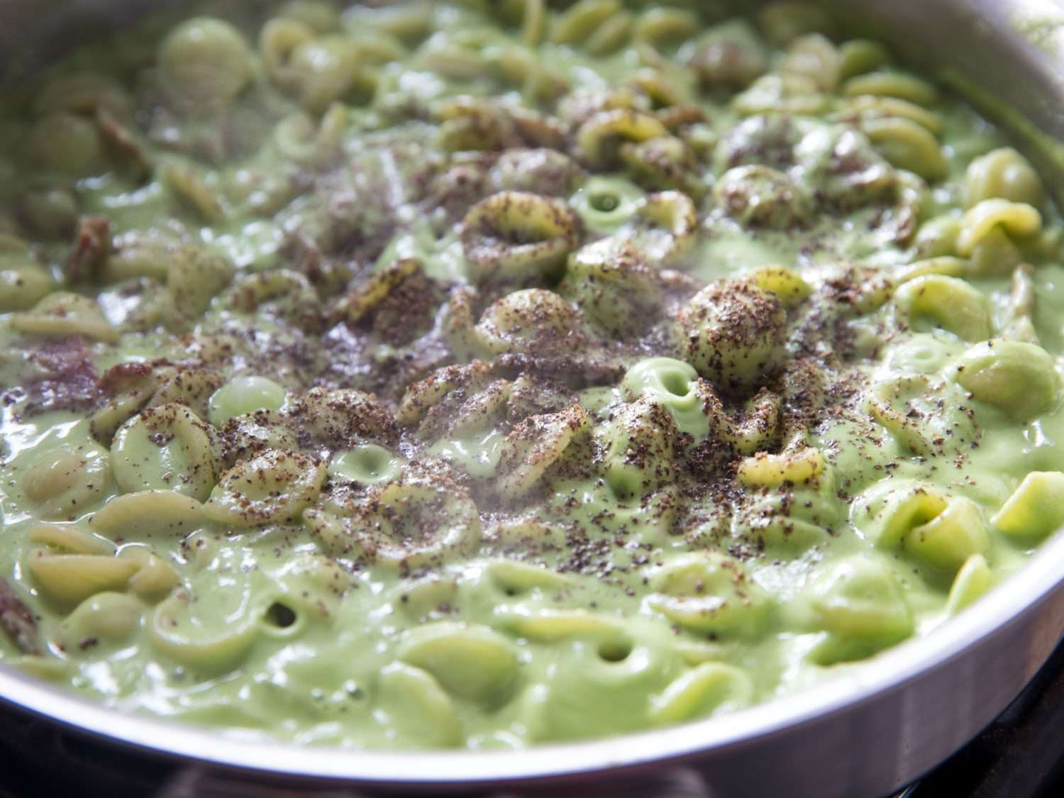 Ground pepper added to the pasta.