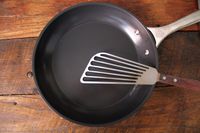 A spatula in the Le Creuset Ceramic Nonstick Frying Pan