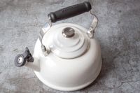 A stovetop kettle with a handle and spout