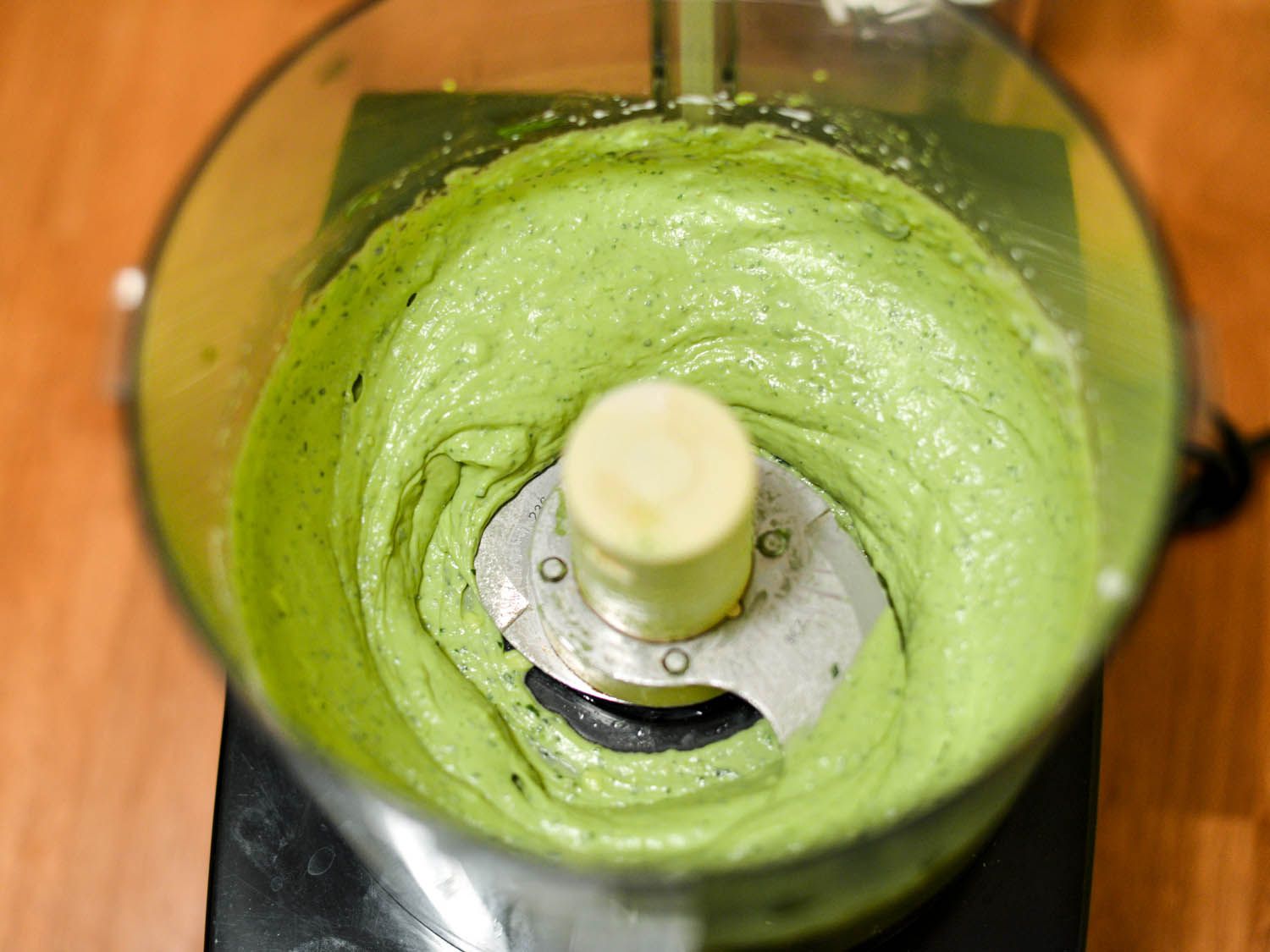 Creamy avocado salsa inside food processor