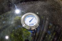 The thermometer on the Weber 18-Inch Smokey Mountain Cooker