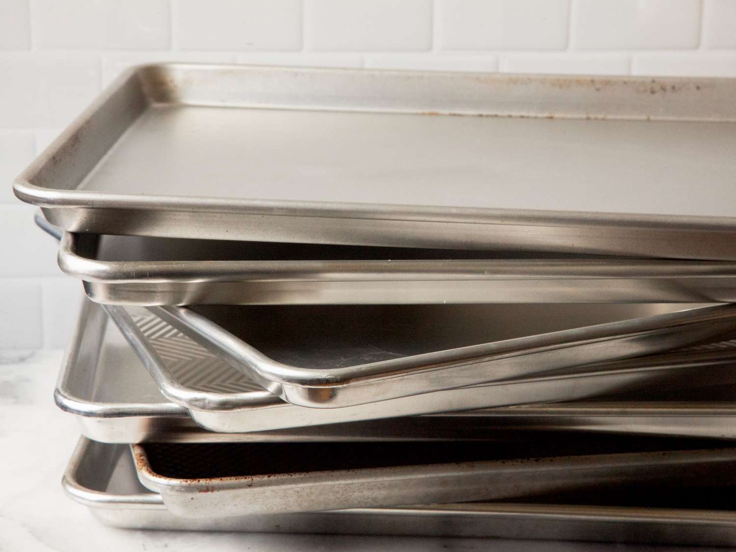 a stack of half sheet pans 