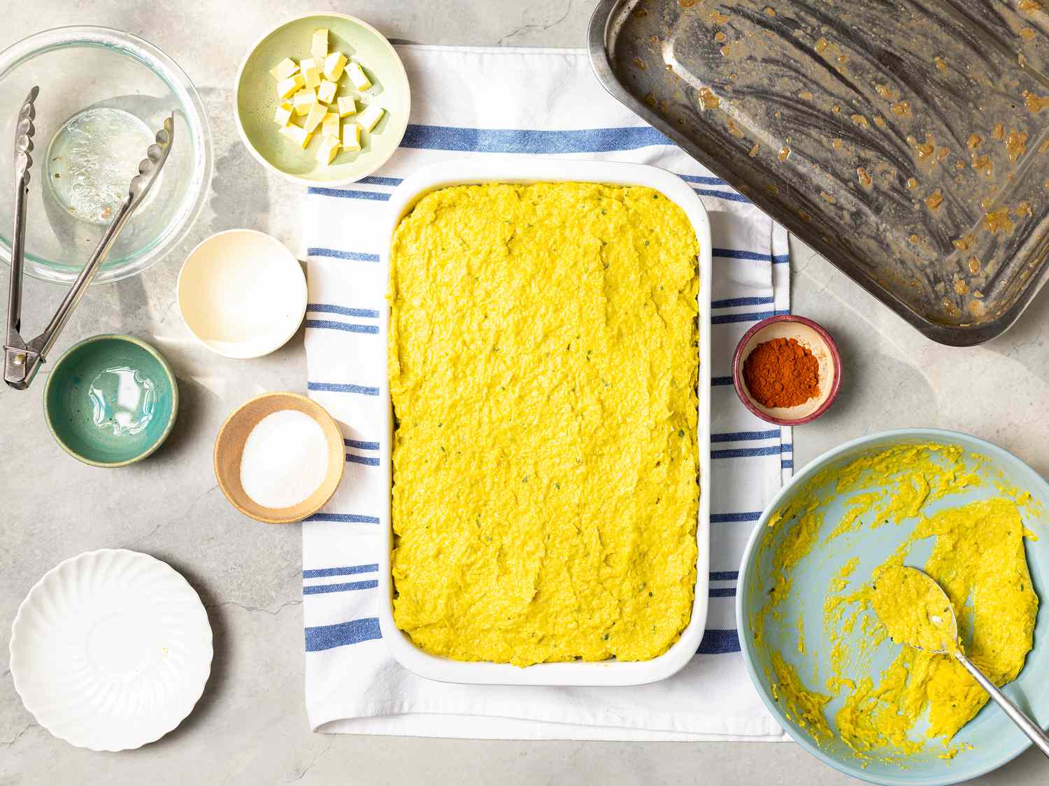 Assembled dish with empty bowls surrounding it