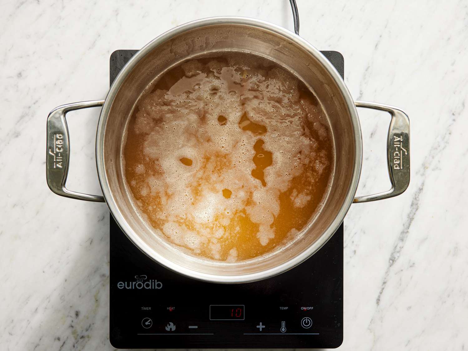 Overhead view of broth in pot
