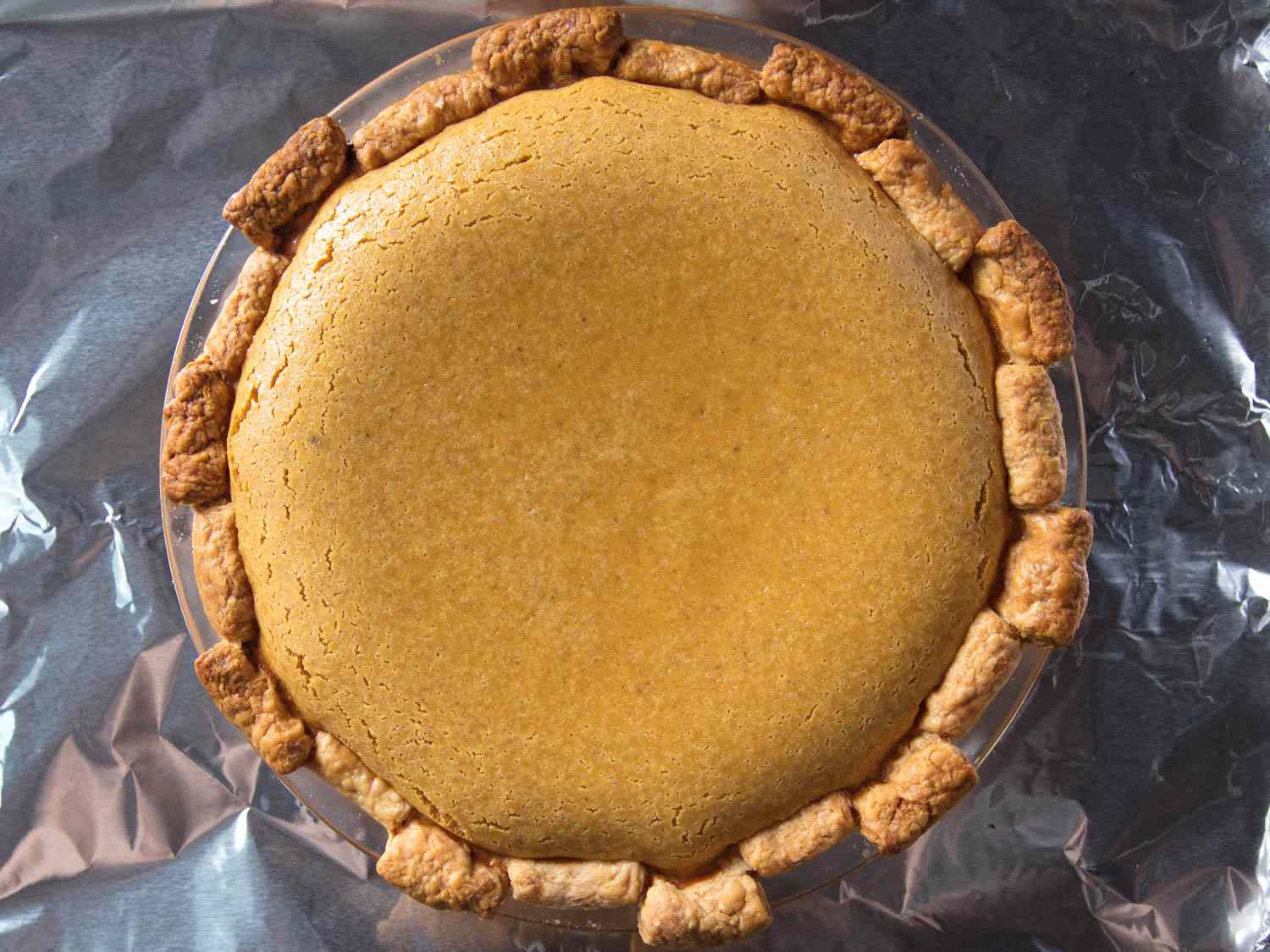 A baked butternut pumpkin pie out of the oven. 