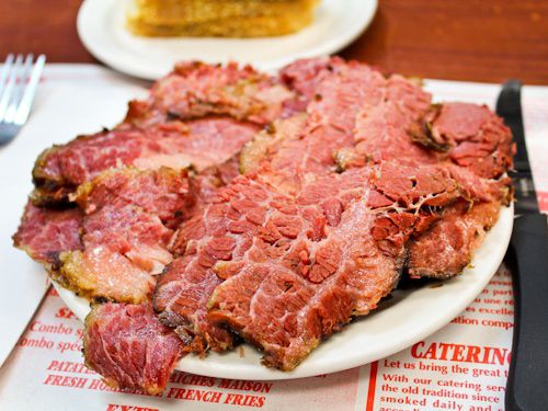 Plate of smoked meat on place mat at Schwartz's.