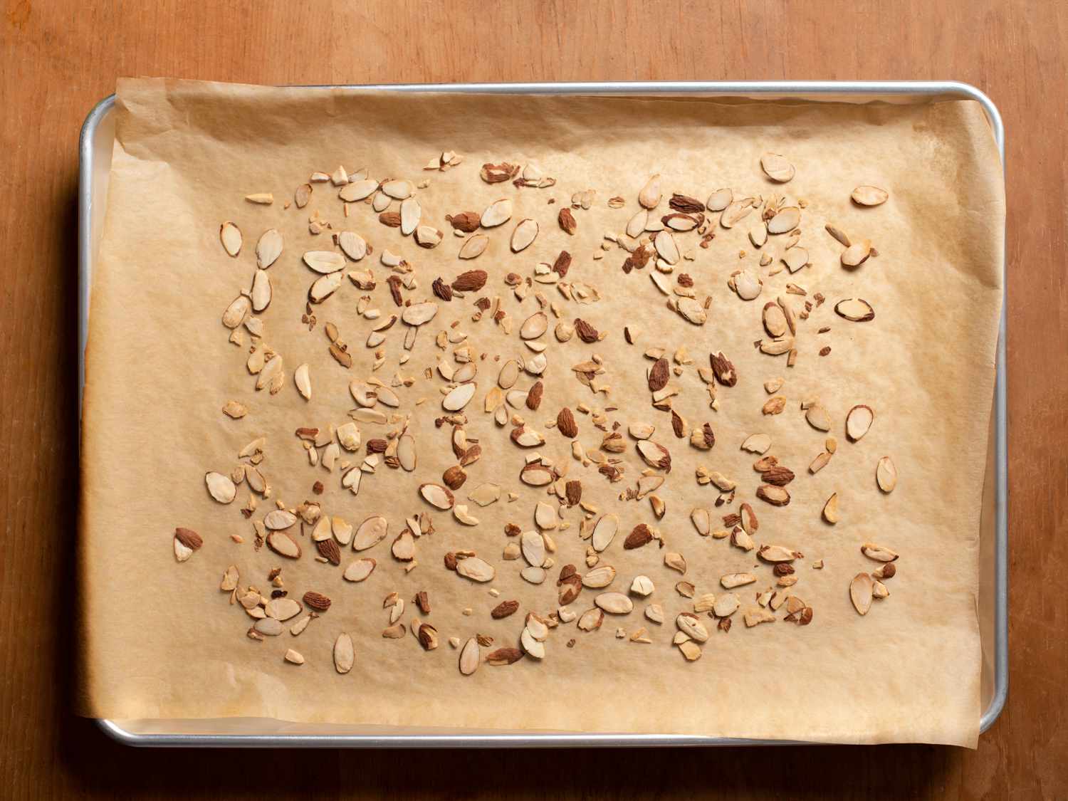 Toasted slivered almonds on a baking sheet