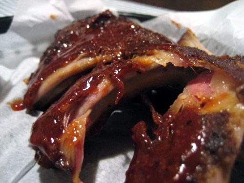 Wet pork ribs on deli paper. 