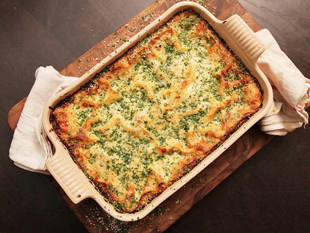 Overhead shot of a baking dish of creamy Brussels sprouts and mushroom lasagna