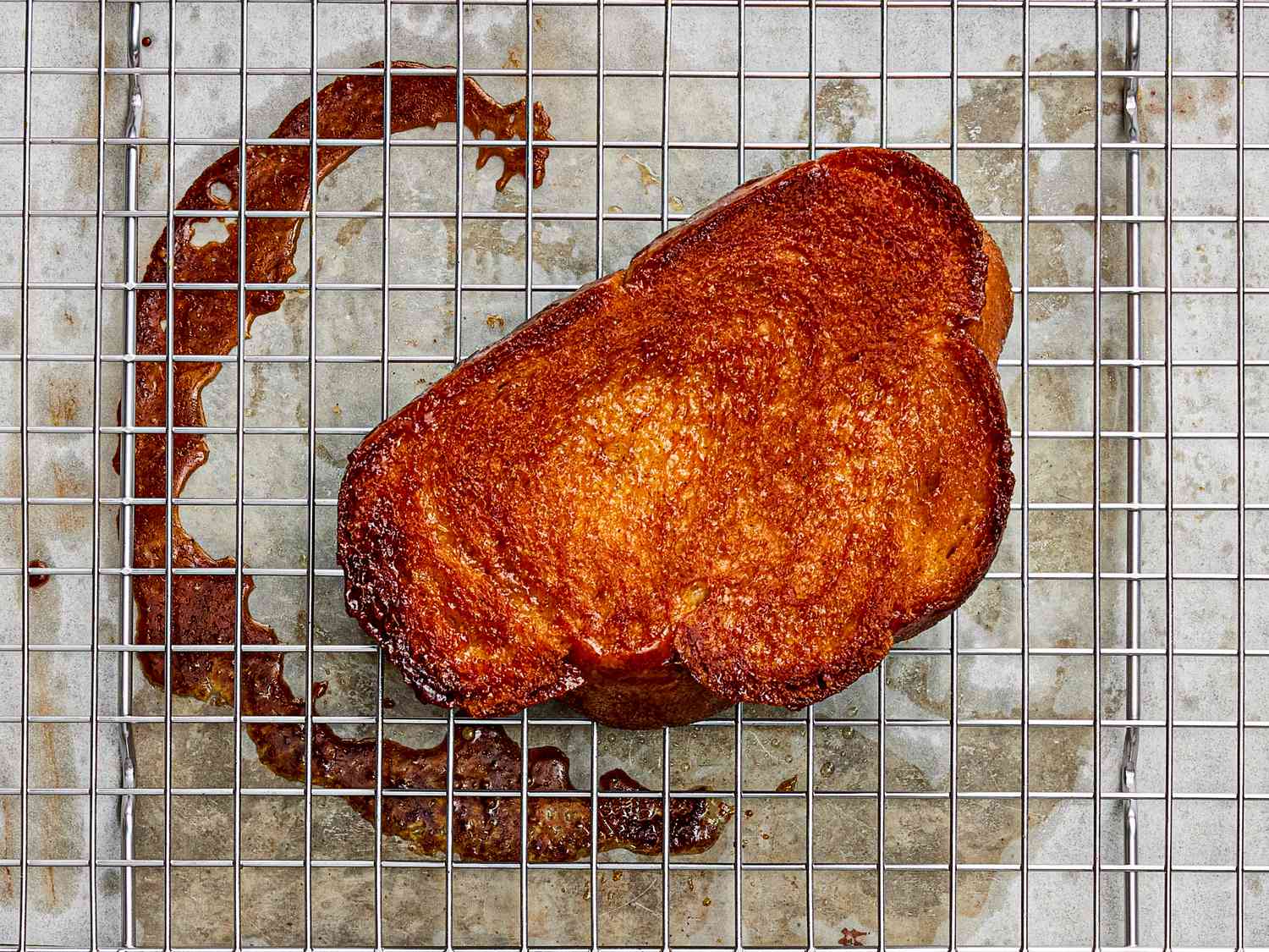 Honey-butter toast resting on wire rack