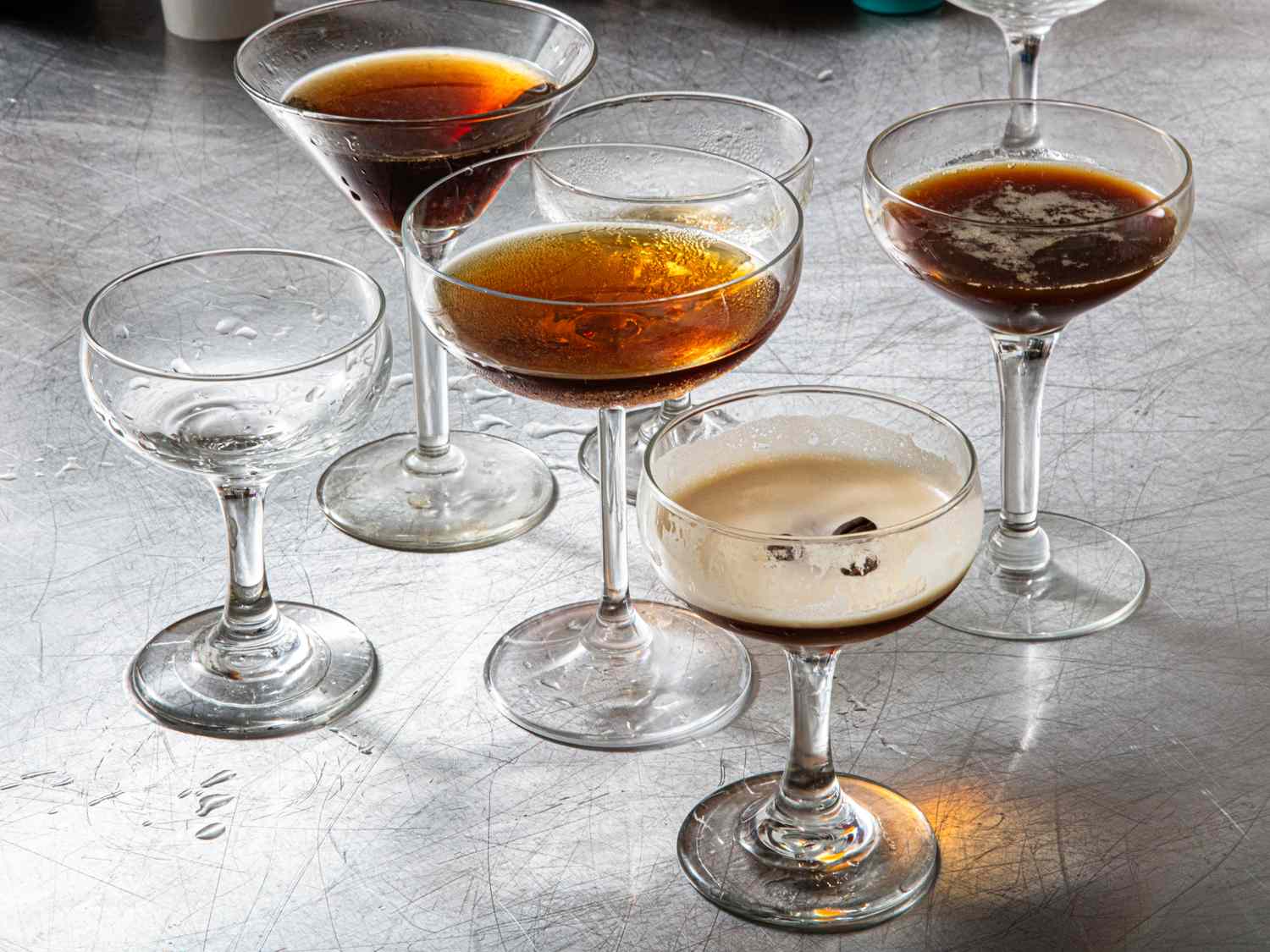 A selection of martini glasses some filled with different espresso cocktail variations