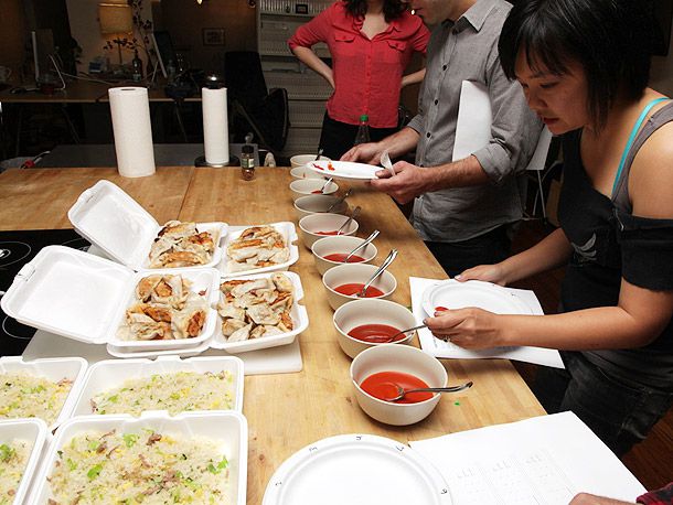 People spooning different srirachas on their plate for a taste test 