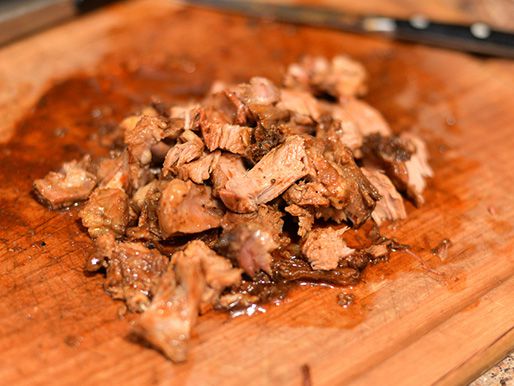The finished chopped lamb barbacoa, piled on a cutting board.
