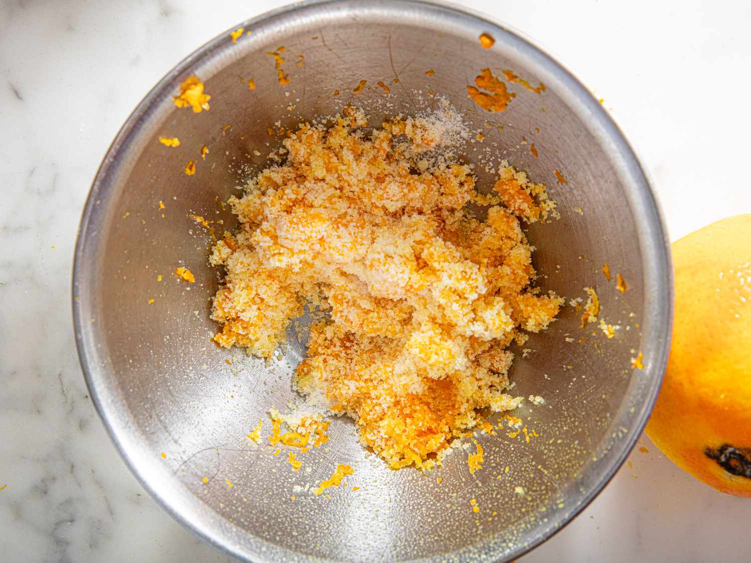 Overhead view of orange zest and sugar