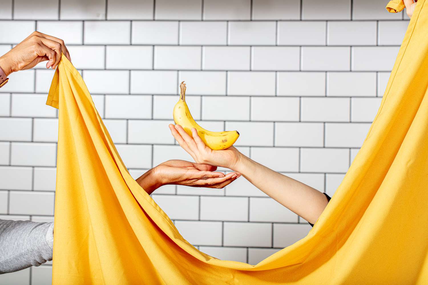 Hands holding a Banana