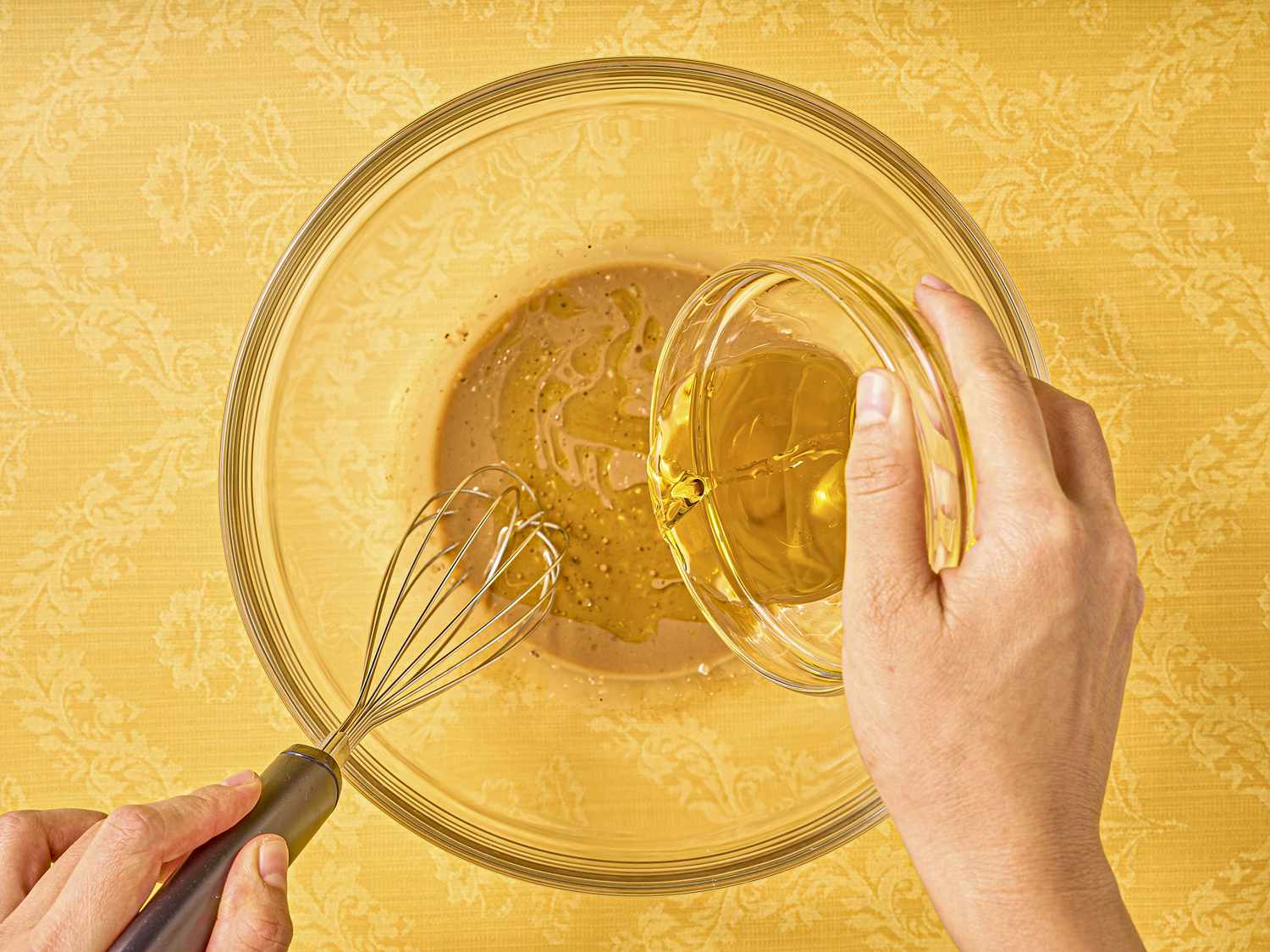 Whisking oil and ingredients together