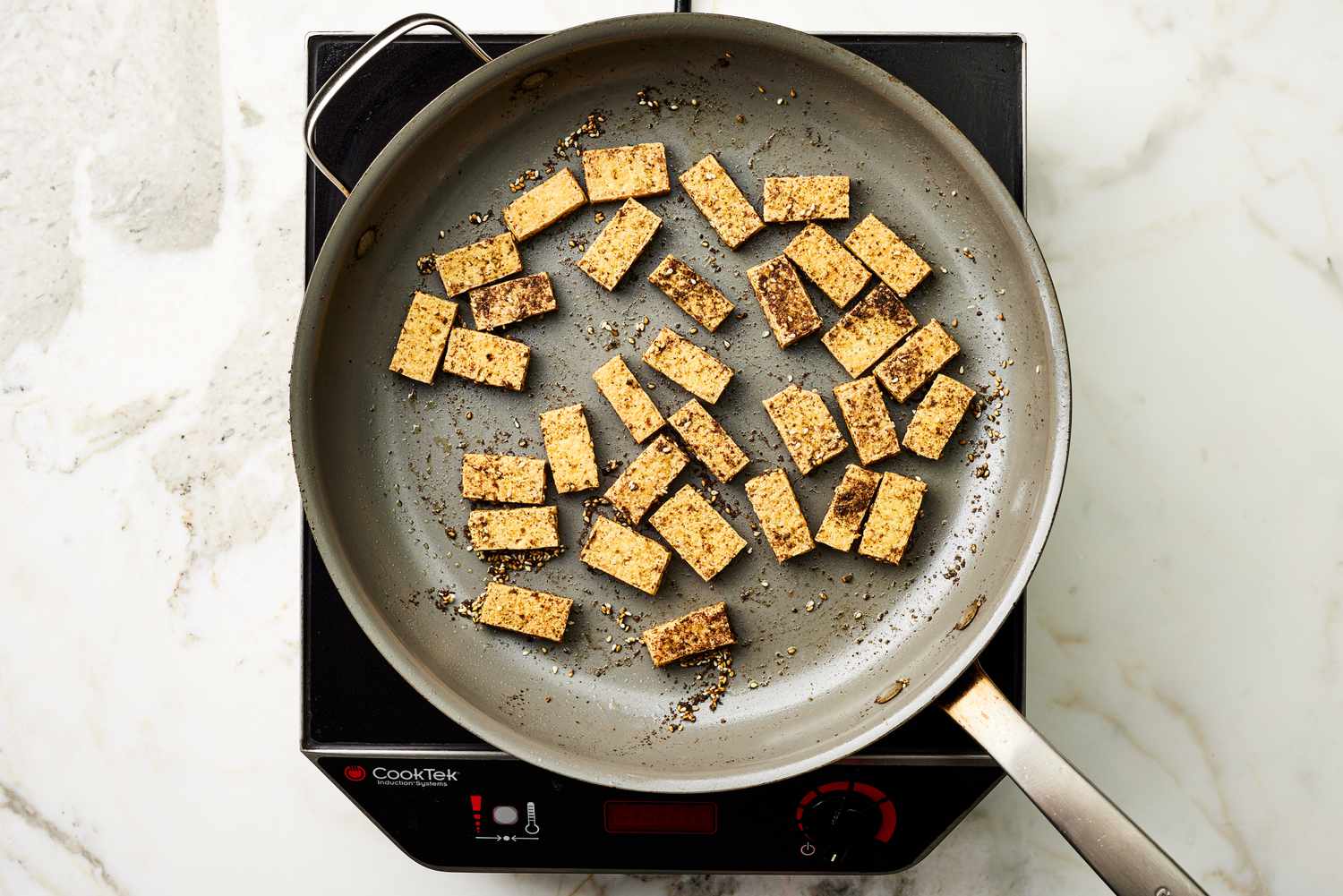 Overhead view of frying tofu