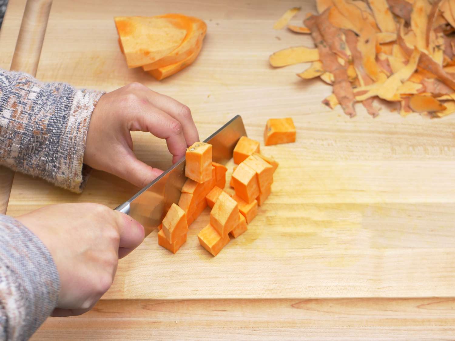 the cangshan knife chopping a sweet potato