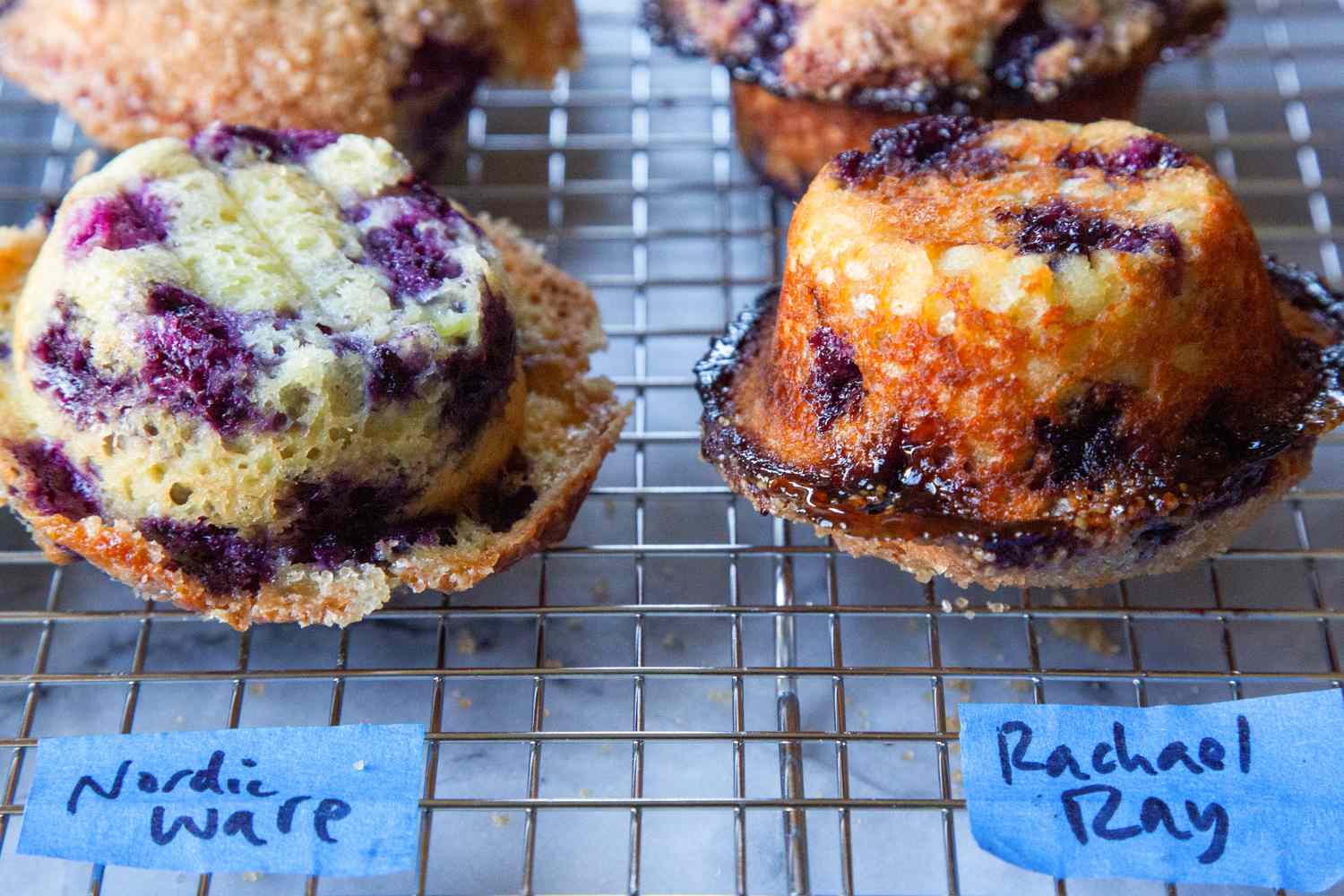 Muffins baked in different pans on cooling rack