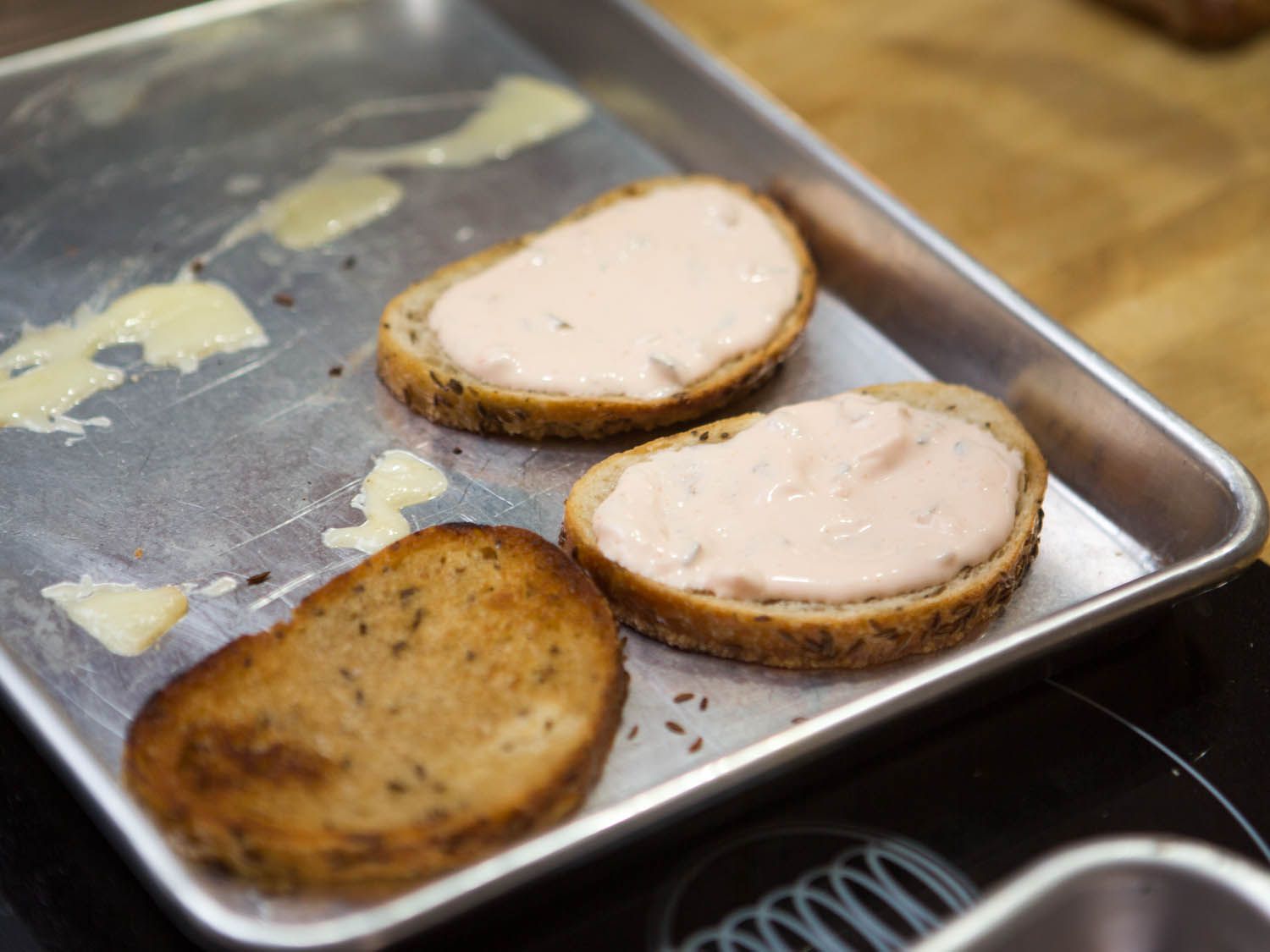 Russian dressing on bread for reuben burger