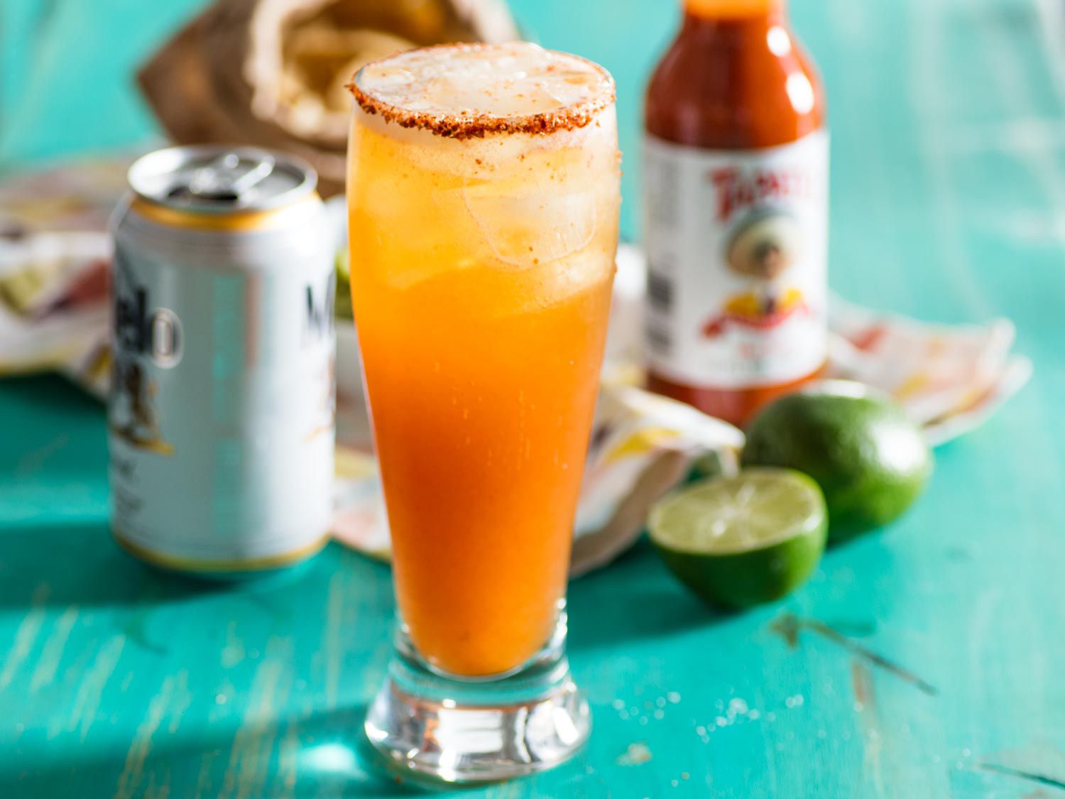 A michelada (Mexican beer, lime, and chili cocktail) in a chili-rimmed glass