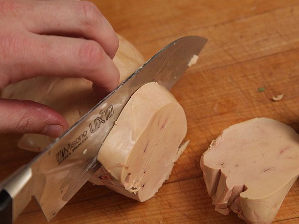 Slicing foie gras into slices of half-inch thickness. 