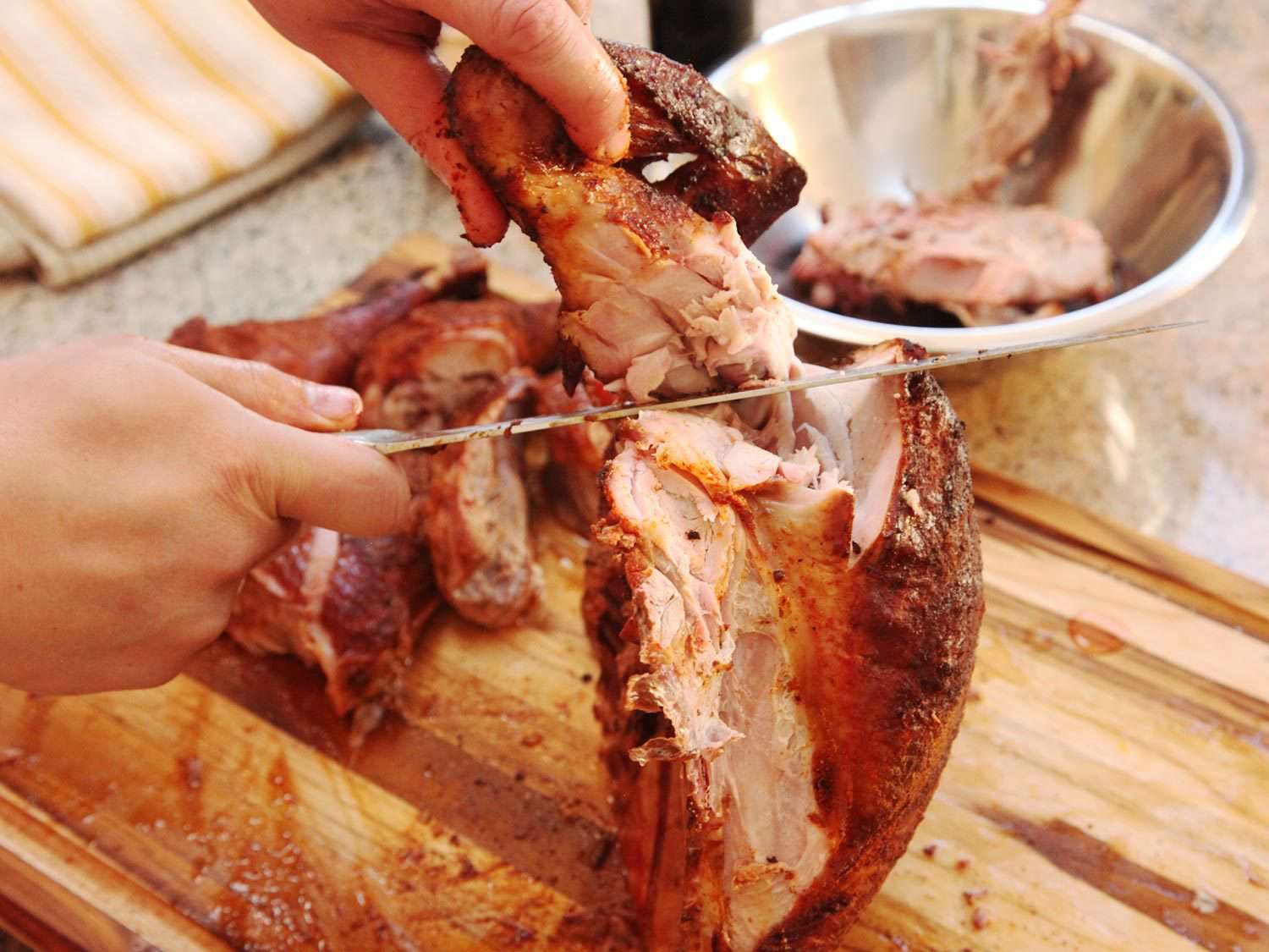Removing smoked turkey wings.