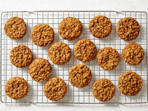 The baked maple brown sugar oatmeal cookies cooling on a wire rack.
